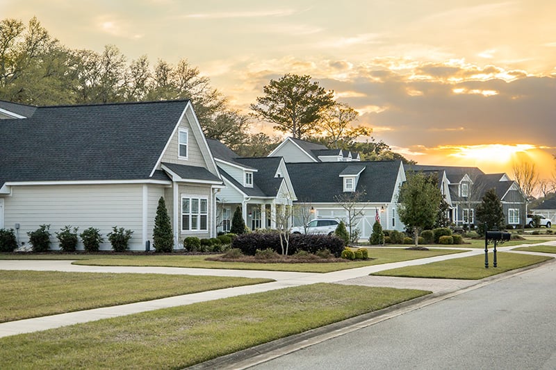 Row of suburban homes at sunset in a new residential neighborhood representing qualified homebuyers identified through mortgage filter tools