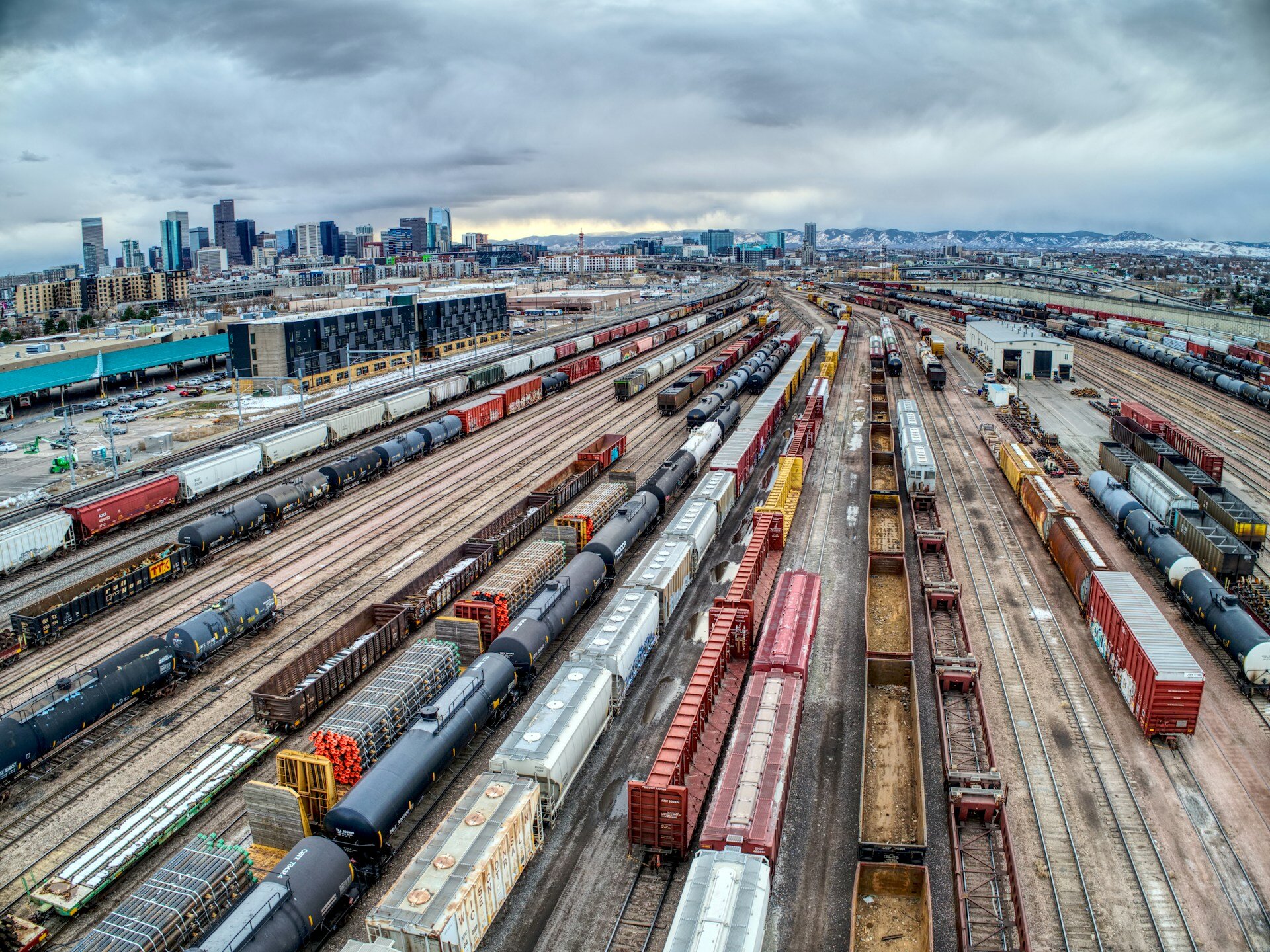 Freight train on a US railroad track illustrating how proximity to national rail networks affects land investment value