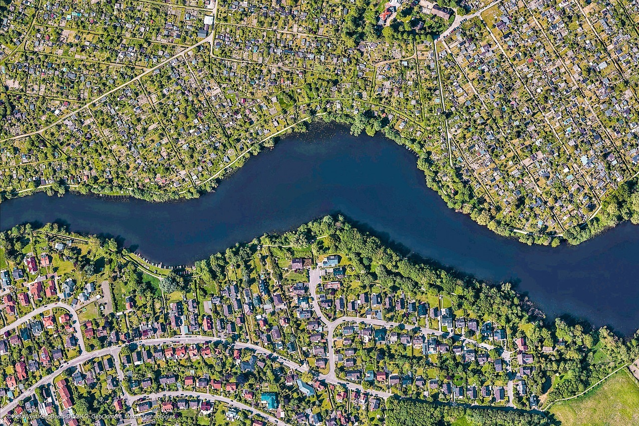 Aerial view of residential housing development illustrating high-risk market conditions for REIT investment strategy